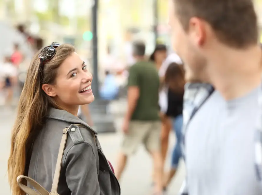woman looking at a man and smiling
