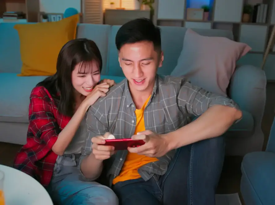couple playing games on phone