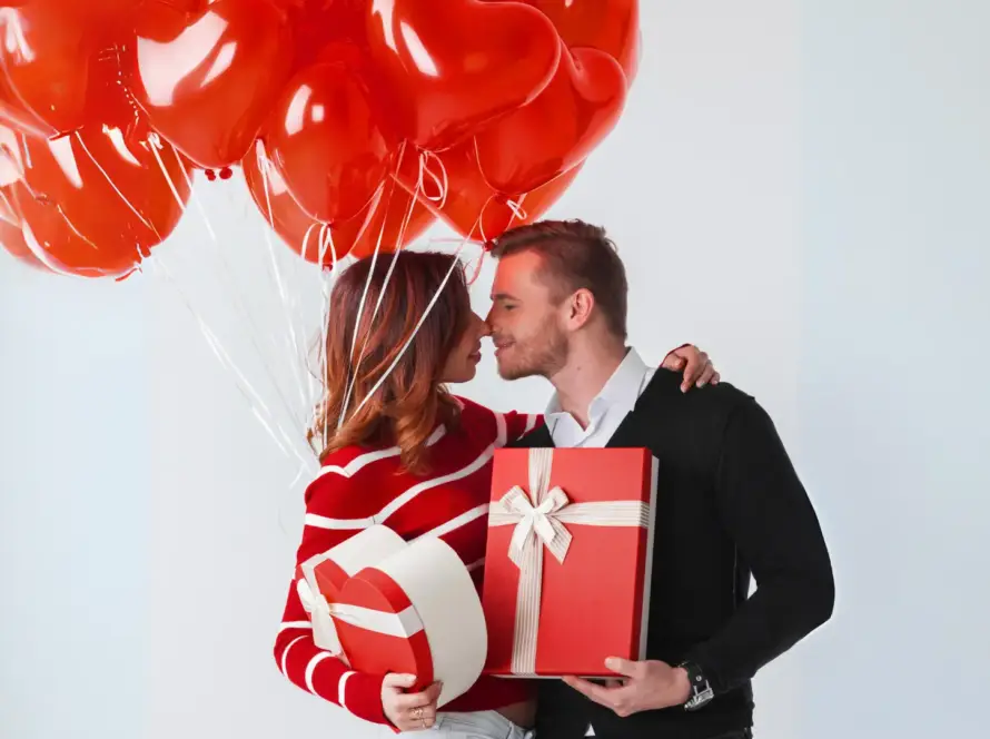 couple with valentine's day gift and baloons