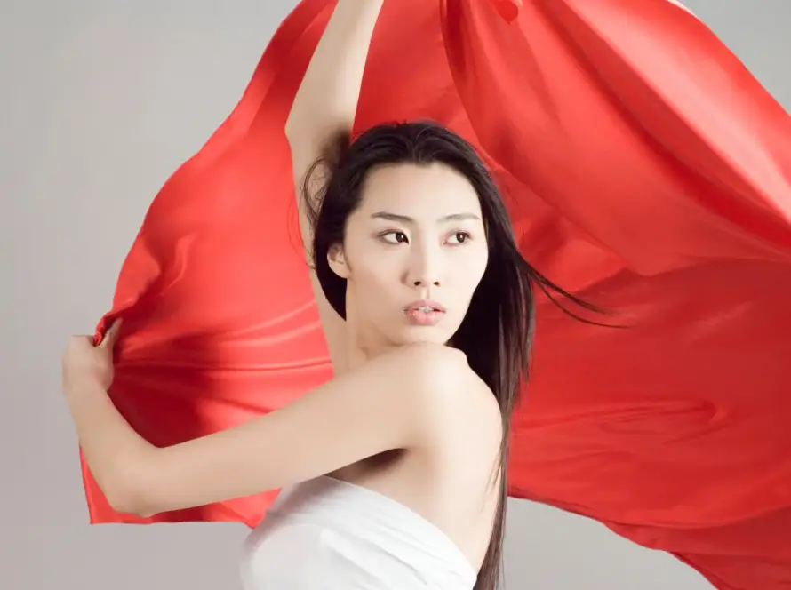 woman holding a giant red flag