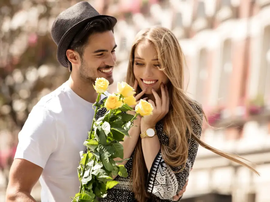 man giving woman flowers